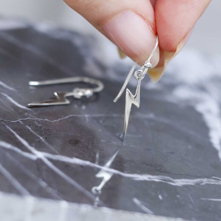 Sterling Silver Lightning Earrings on table