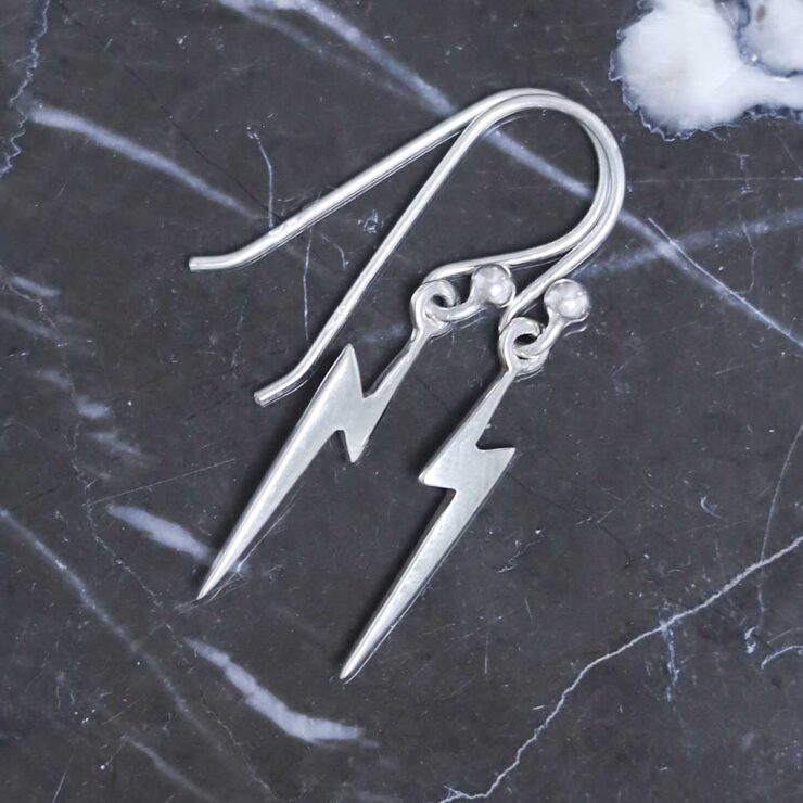 Sterling Silver Lightning Earrings on table
