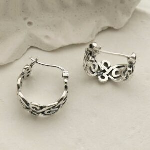 silver celtic knot hoops with latch laid flat