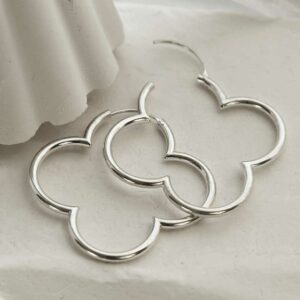 silver flower hoops strewn