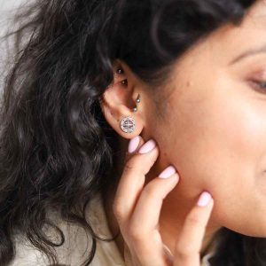 Model Wearing Silver Compass Studs