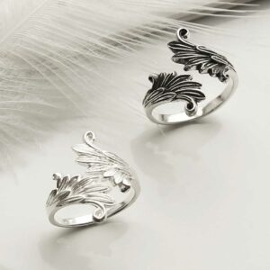 Oxidised and polished Adjustable Wing Ring on white background with feather detail