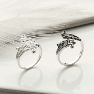 Oxidised and polished Adjustable Wing Ring on white background with feather detail