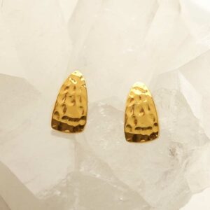 gold hammered triangle studs on crystal background