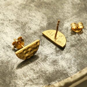 gold hammered semi circle studs on terracotta