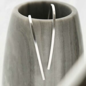 Silver drop earrings coming out a pot