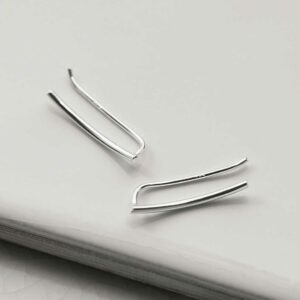 Curve Threader Climber earring on white tile background