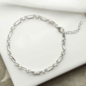 silver long and circle link bracelet laid in circle