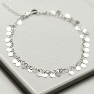 silver disc anklet laid in circle