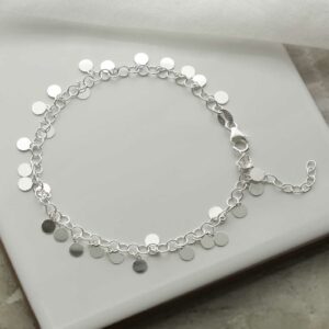 silver disc bracelet laid in circle