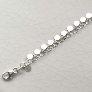 silver disc necklace laid straight