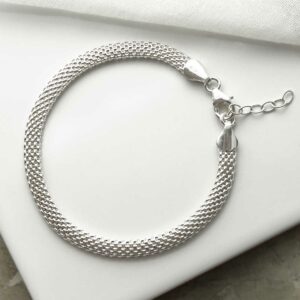 silver mesh bracelet laid in circle