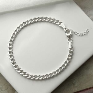 silver thick curb bracelet laid in circle