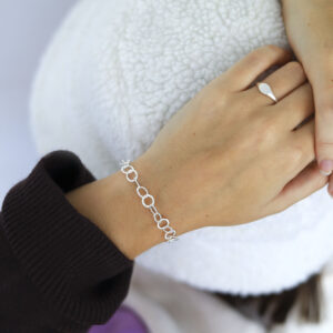 silver hammered link bracelet on model