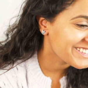 Brunette Model in purple jumper wearing Sterling Silver Hummingbird Studs