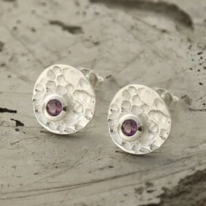 single amethyst gem in centre of hammered stud earrings