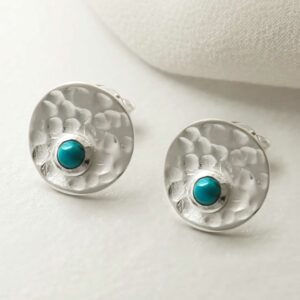 single turquoise gem in centre of hammered stud earrings