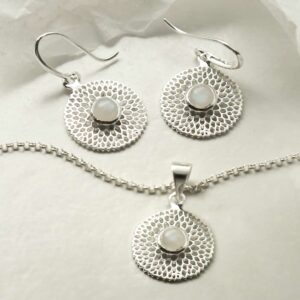 single moonstone gems in centre of chrysanthemum necklace and earrings