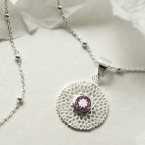 single amethyst gem in centre of chrysanthemum pendant