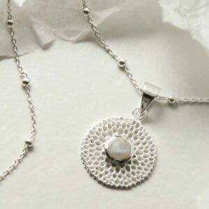 single moonstone gem in centre of chrysanthemum pendant