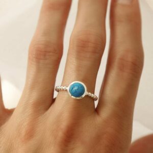 silver beaded band turquoise ring on model