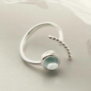 silver adjustable blue topaz ring with beaded side laid