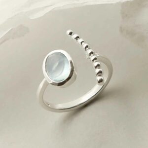 silver adjustable blue topaz ring with beaded side upright