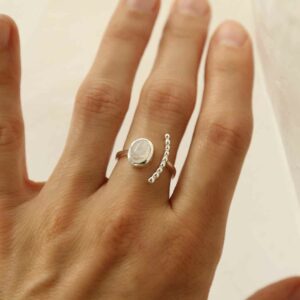 silver adjustable moonstone ring with beaded side on model