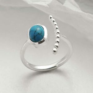 silver adjustable turquoise ring with beaded side upright