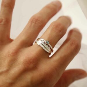 silver labradorite ring with feather band on model