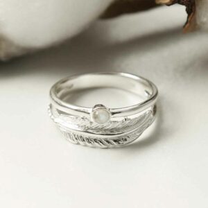 silver moonstone ring with feather band laid