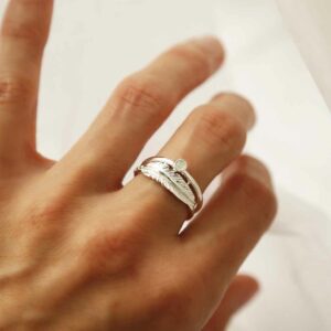 silver moonstone ring with feather band on model