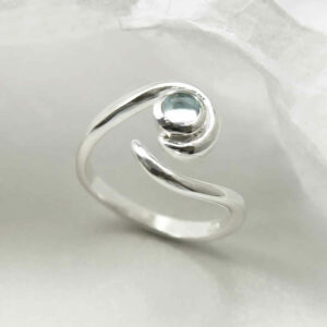 silver adjustable blue topaz ring with spiral band upright