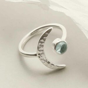 silver adjustable blue topaz ring with crescent laid