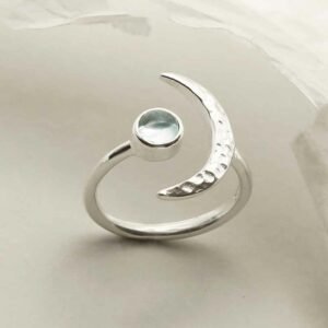 silver adjustable blue topaz ring with crescent upright