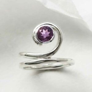 silver winding band amethyst ring laid