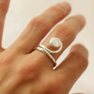 silver winding band moonstone ring on model