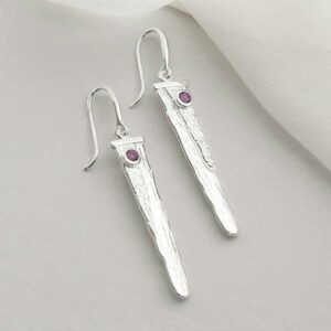 silver water pour earrings with amethyst laid