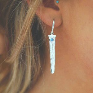 silver water pour earrings with opalite on model