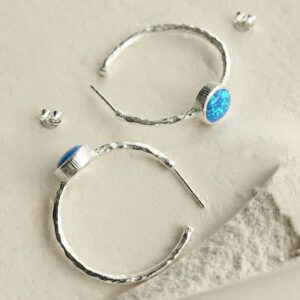 silver textured stud hoops with opalite top down