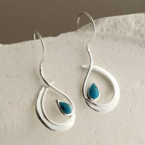 silver large loop drop earrings with turquoise in centre hanging