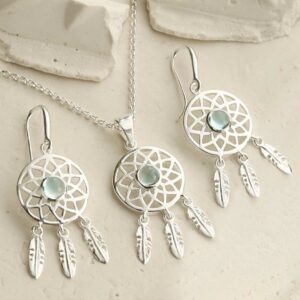 silver dangly dream catcher necklace and earrings with centre blue topazes