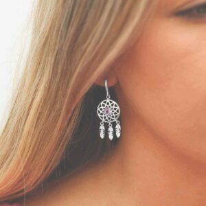 silver dangly dream catcher earrings with centre amethyst on model