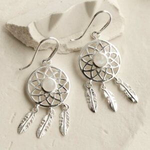 silver dangly dream catcher earrings with centre moonstone leaning