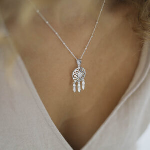 silver dangly dream catcher necklace with centre moonstone on model