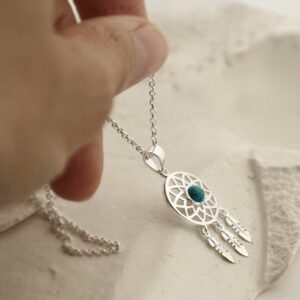 silver dangly dream catcher necklace with centre turquoise plain chain