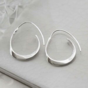 silver thick ribbon hoops on tile