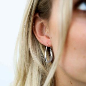 Blonde Model Wearing Sterling Silver Bold Loop Hoops