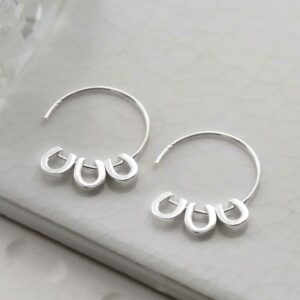 silver three horseshoes on plain hoops on tile