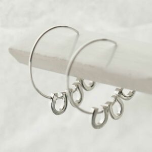 silver three horseshoes on plain hoops hanging